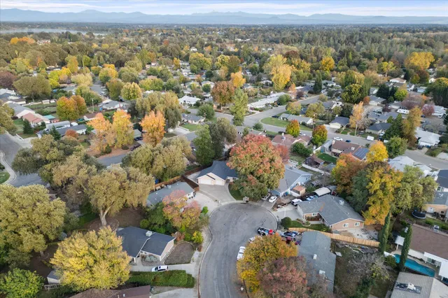 an aerial view of residential houses with outdoor space