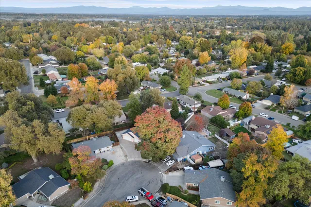 an aerial view of residential houses with outdoor space