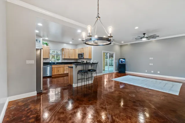 a view of a kitchen and dining room