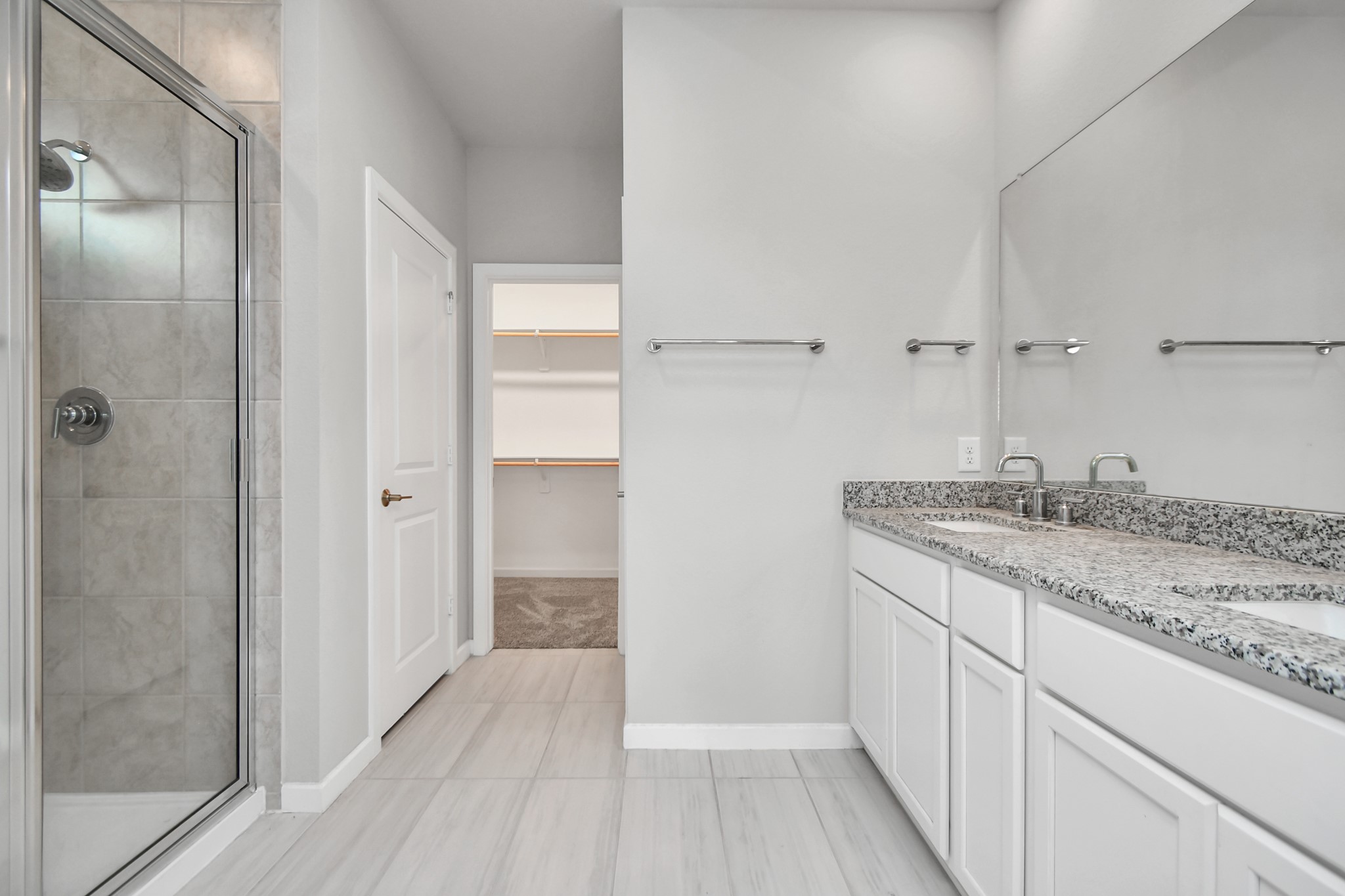 1218 Raburn Run Lane Tomball, TX 77375 - Photo 18 of 37 a bathroom with a granite countertop sink and shower