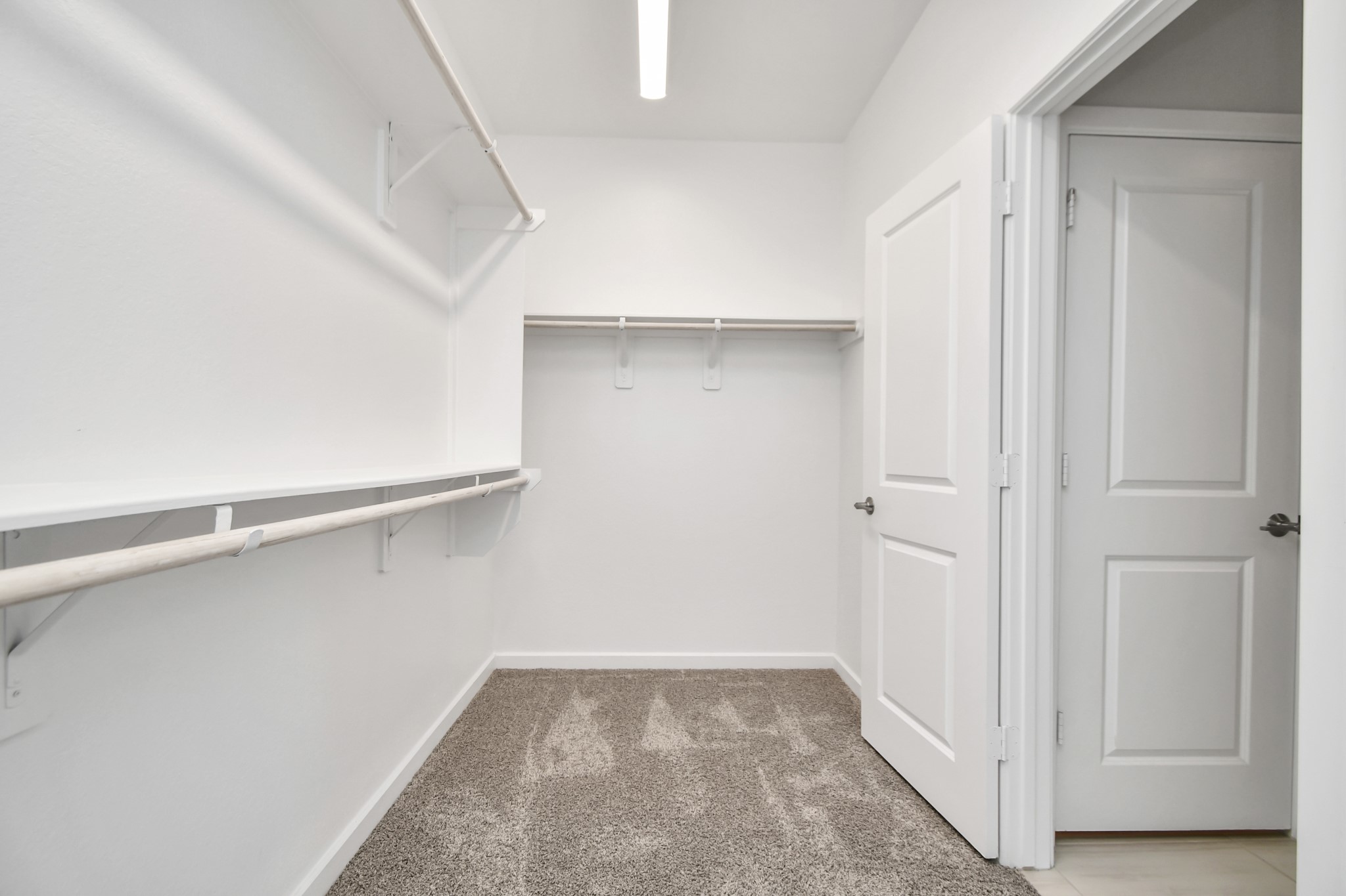 1218 Raburn Run Lane Tomball, TX 77375 - Photo 19 of 37 a view of an empty walk in closet