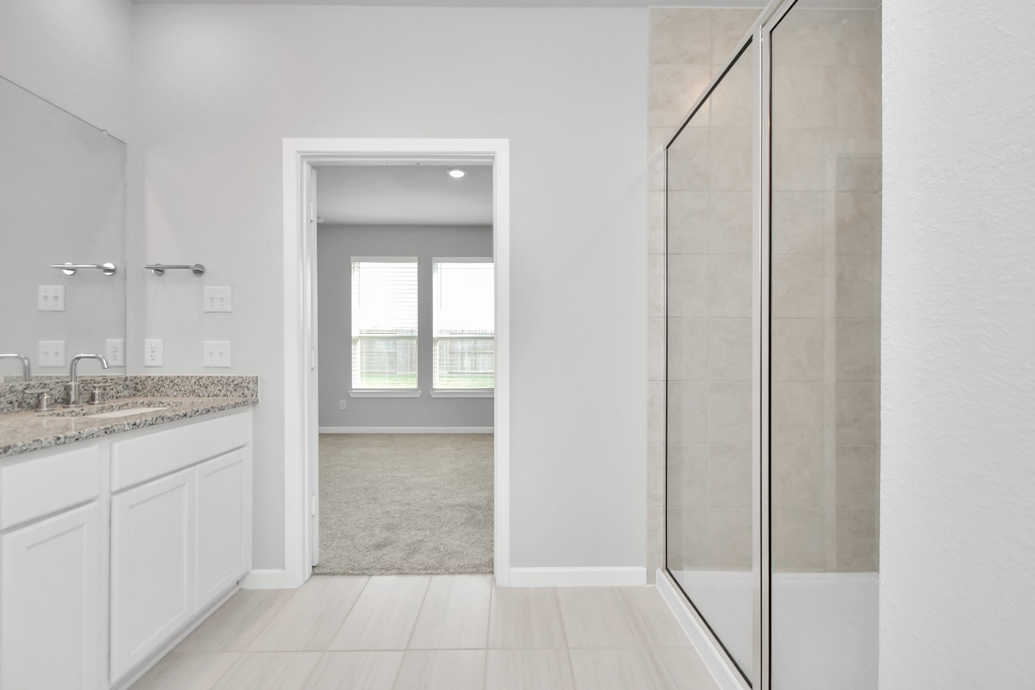 1218 Raburn Run Lane Tomball, TX 77375 - Photo 20 of 37 a bathroom with a granite countertop sink and a mirror