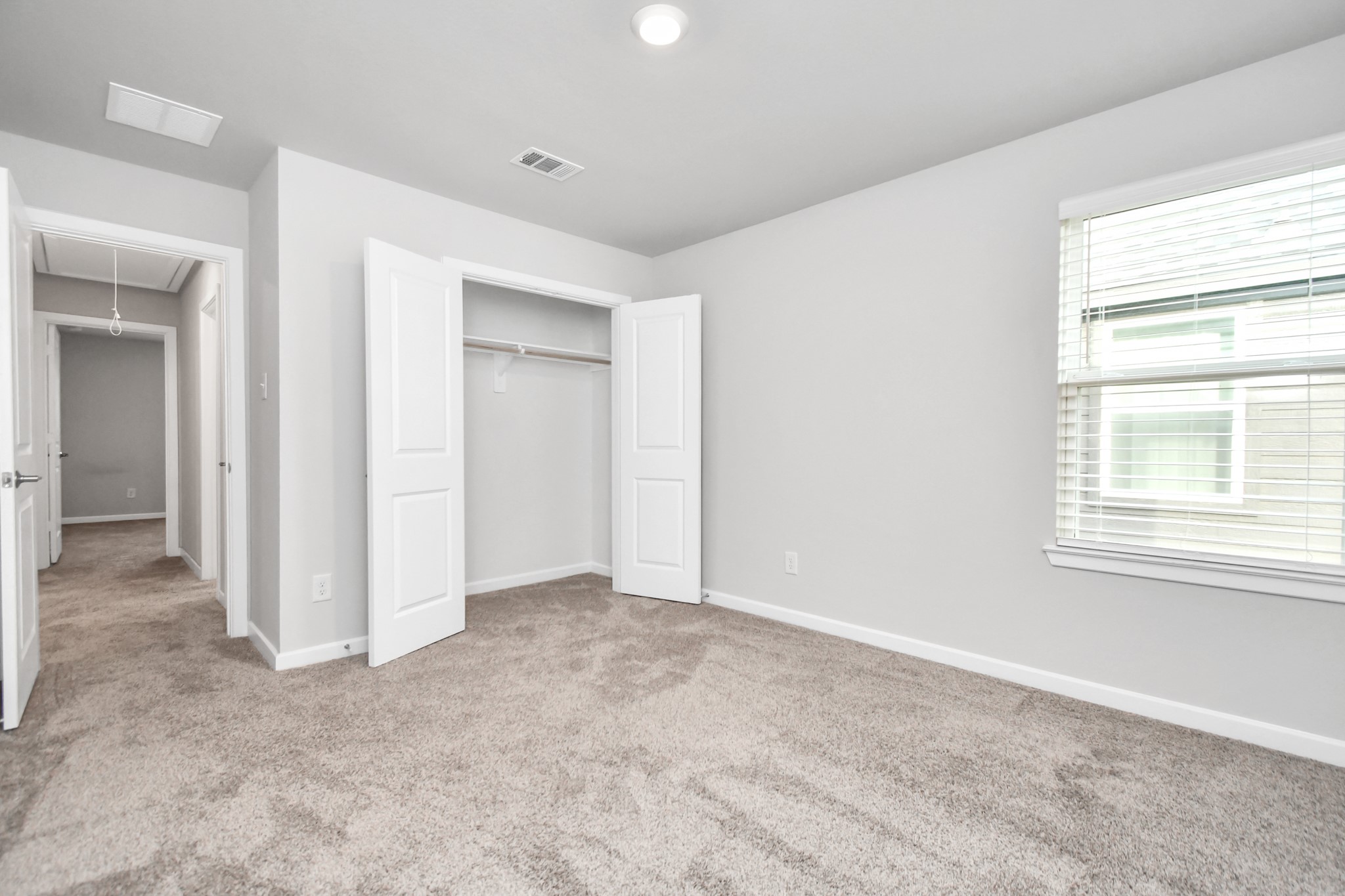 1218 Raburn Run Lane Tomball, TX 77375 - Photo 28 of 37 an empty room with windows and closet