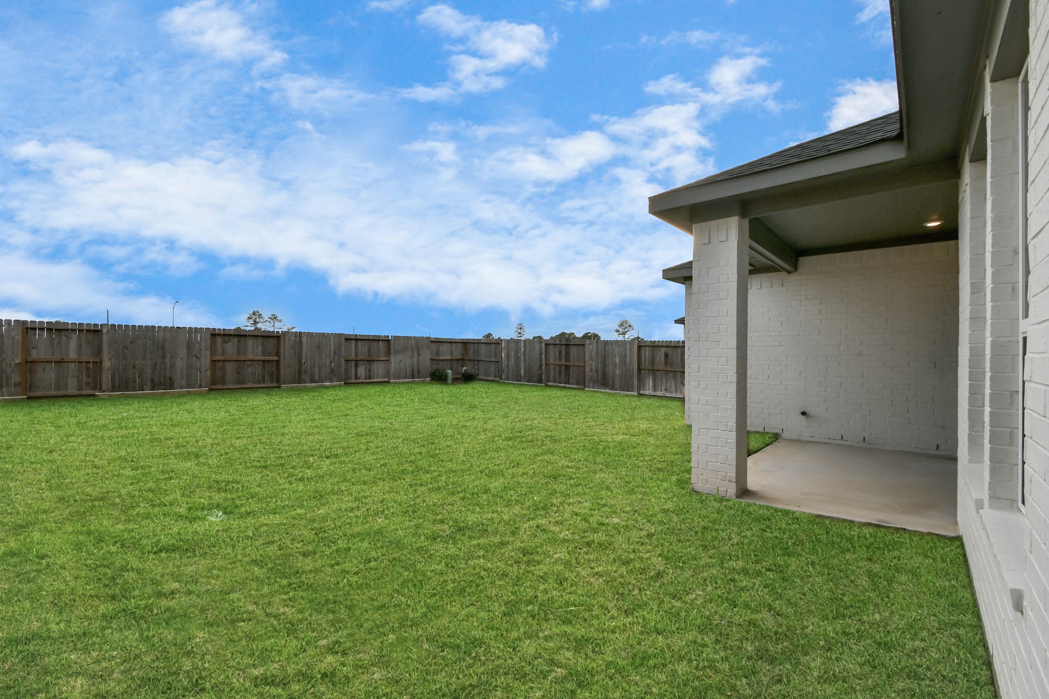 1218 Raburn Run Lane Tomball, TX 77375 - Photo 32 of 37 a view of backyard with trampoline