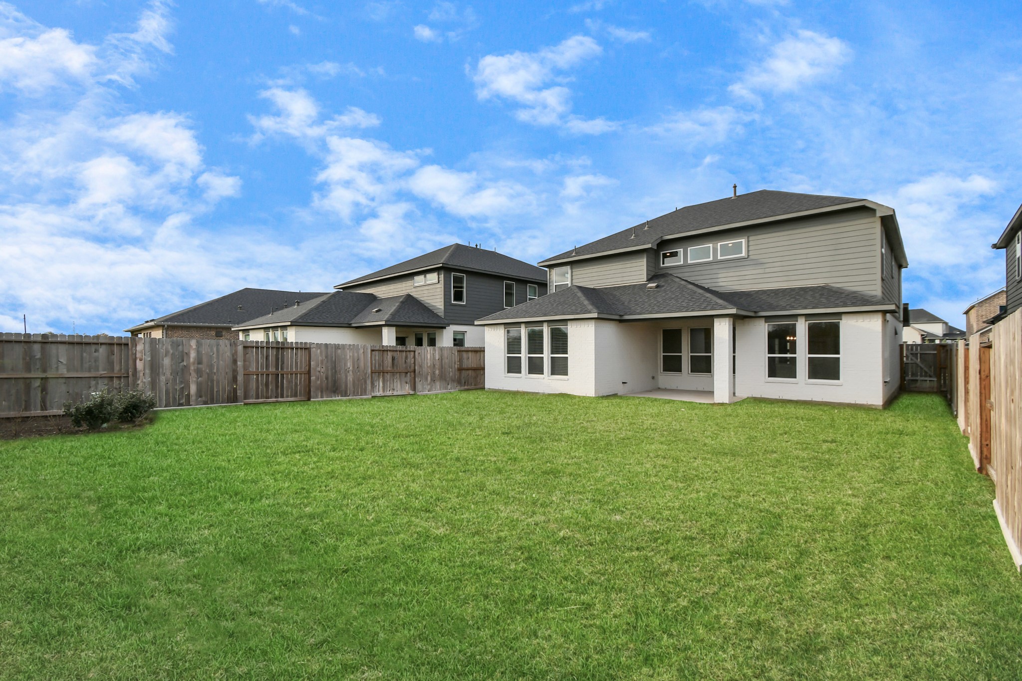1218 Raburn Run Lane Tomball, TX 77375 - Photo 33 of 37 a view of a big house with a big yard and large trees