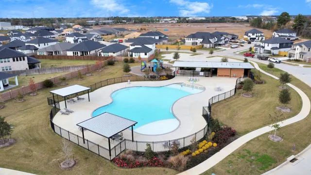 an aerial view of a swimming pool patio and mountain view