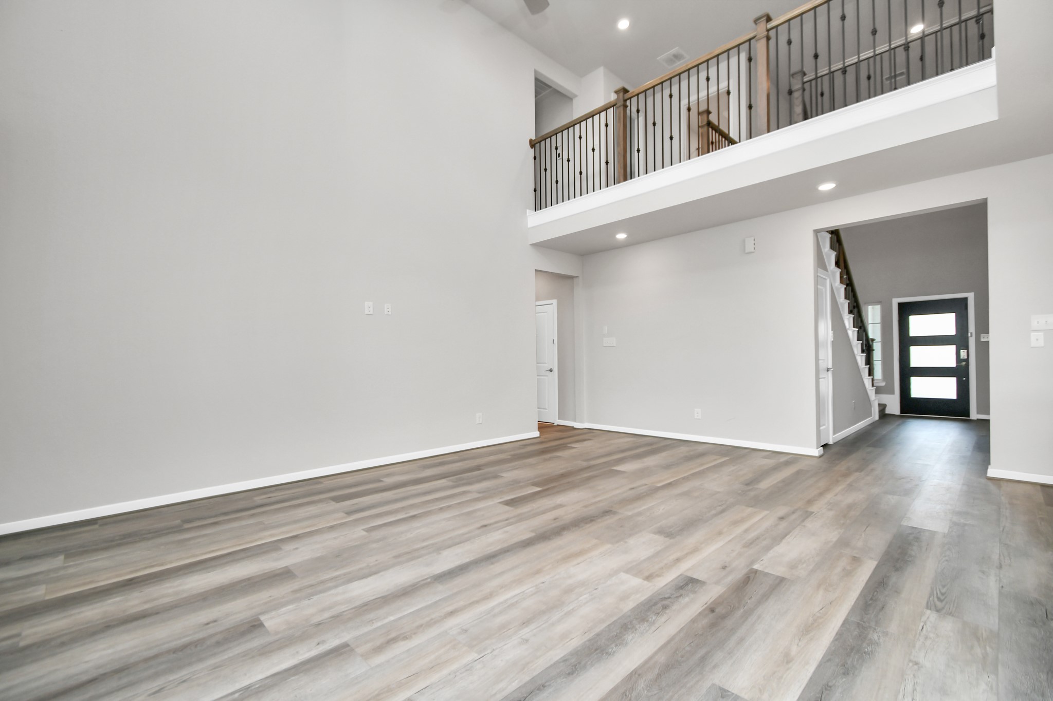 1218 Raburn Run Lane Tomball, TX 77375 - Photo 6 of 37 a view of an entryway with wooden floor