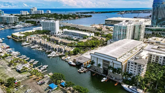 a view of a lake with a building and outdoor space