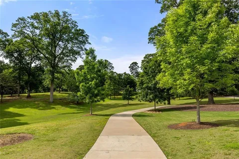 a group of people sitting under an umbrella
