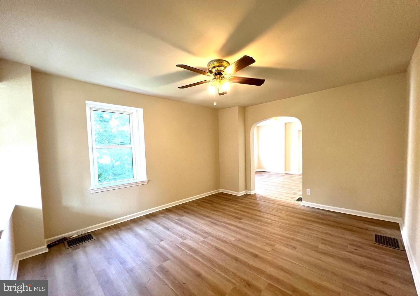617 3rd Street Beverly, NJ 08010 - Photo 8 of 16 a view of an empty room with window and wooden floor
