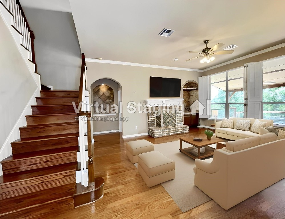 a living room with fireplace furniture and a flat screen tv