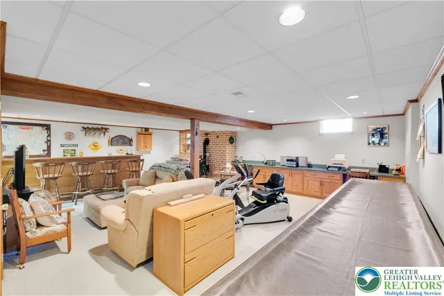 a very nice looking living room with furniture and a large window