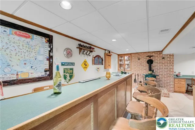 a view of a kitchen with stainless steel appliances granite countertop a sink and a microwave