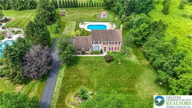 a view of a back yard of the house and green space