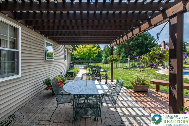 a view of a table and chairs in patio of the house