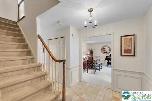 a view of entryway and hall with dining room