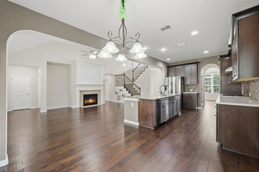 12809 Spring Hill Drive Frisco, TX 75035 - Photo 14 of 37 a view of a kitchen and dining room