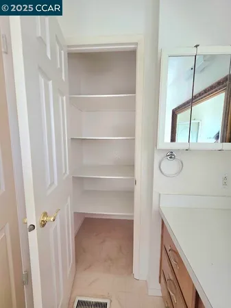 a bathroom with a glass shower door