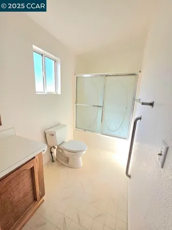 a bathroom with a sink a mirror and a vanity