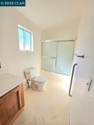 a bathroom with a sink a mirror and a vanity