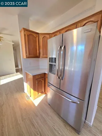 a kitchen with stainless steel appliances a refrigerator and a sink