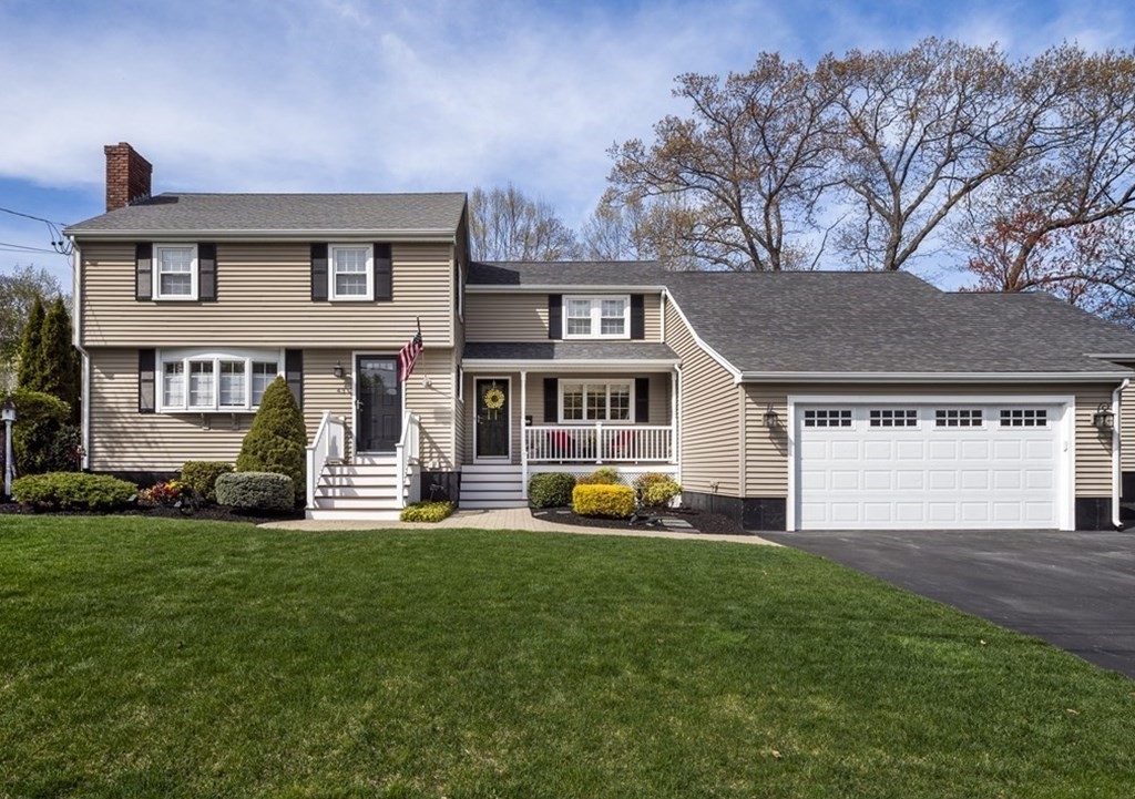 43 Windsor Road Stoneham, MA 02180 - Photo 1 of 42 a front view of a house with a yard and garage
