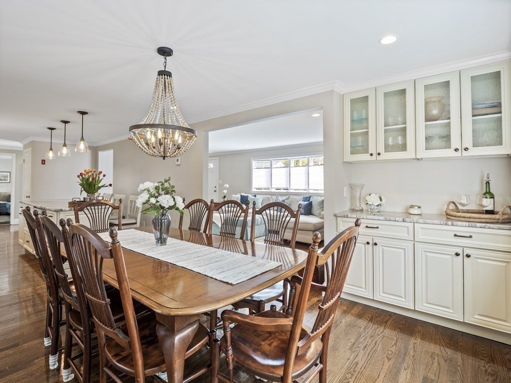 43 Windsor Road Stoneham, MA 02180 - Photo 11 of 42 a view of a dining room with furniture a chandelier and wooden floor