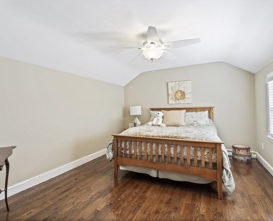 43 Windsor Road Stoneham, MA 02180 - Photo 22 of 42 a bed sitting in a bedroom next to a wooden floor