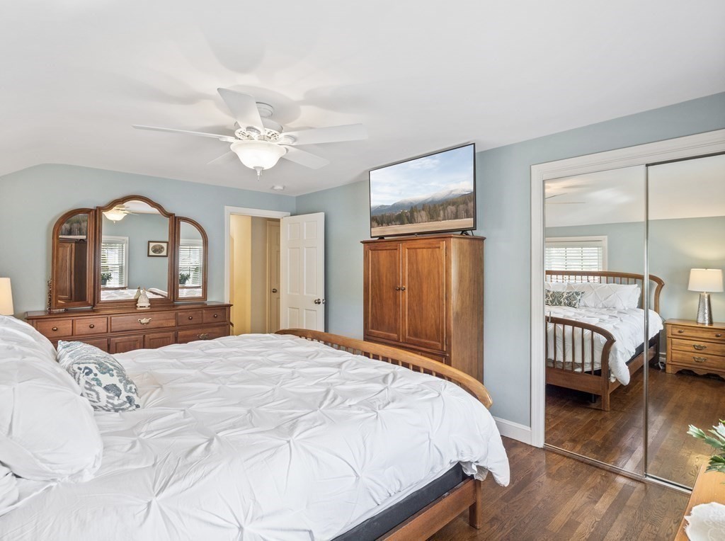 43 Windsor Road Stoneham, MA 02180 - Photo 24 of 42 a bedroom with a bed and dresser with mirror