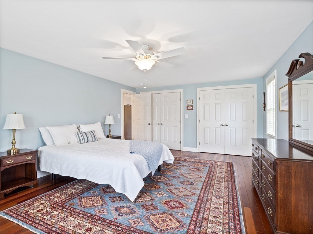 43 Windsor Road Stoneham, MA 02180 - Photo 30 of 42 a bedroom with a large bed and a chandelier