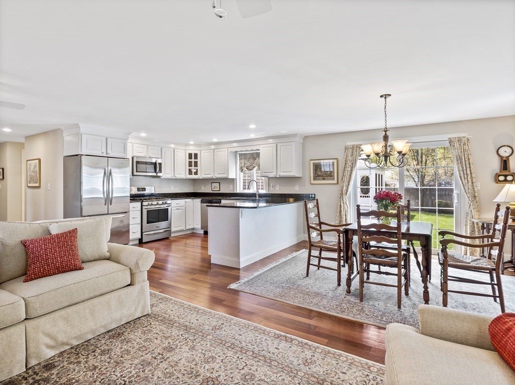 43 Windsor Road Stoneham, MA 02180 - Photo 35 of 42 a living room with stainless steel appliances furniture and a kitchen view