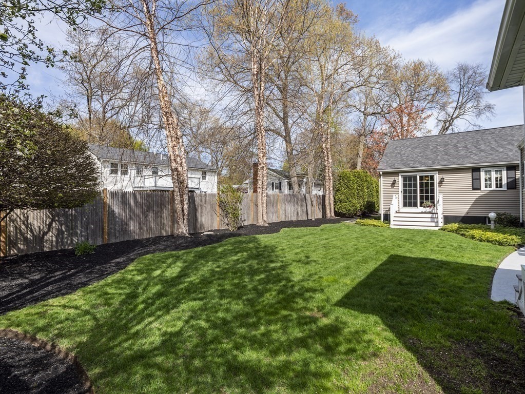 43 Windsor Road Stoneham, MA 02180 - Photo 38 of 42 a view of a yard with a house and garden