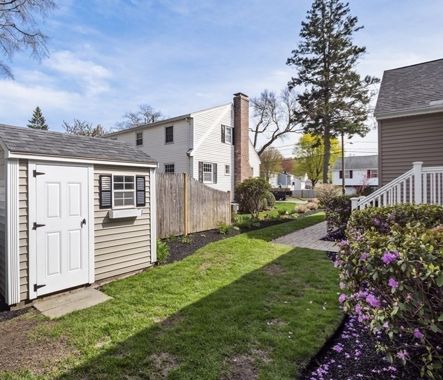 43 Windsor Road Stoneham, MA 02180 - Photo 40 of 42 a view of a house with a backyard
