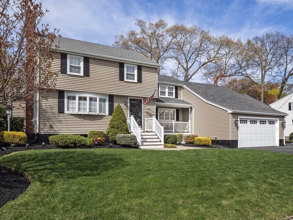 43 Windsor Road Stoneham, MA 02180 - Photo 41 of 42 a front view of a house with a yard and trees