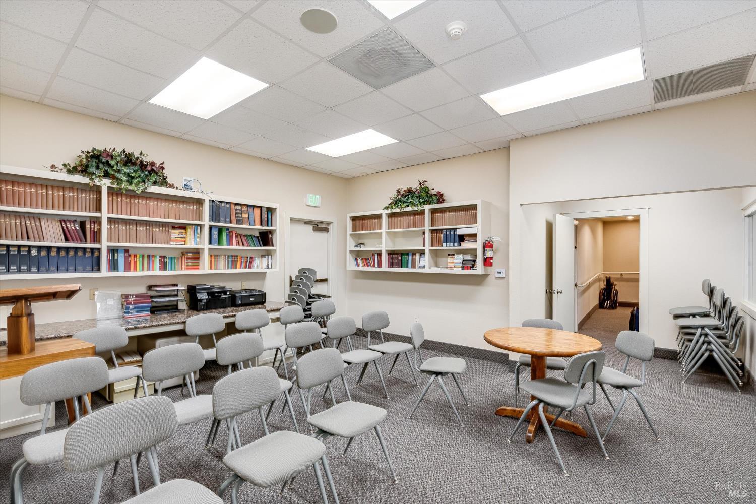 1105 University Avenue Healdsburg, CA 95448 - Photo 19 of 29 a living room with furniture window and a bookshelf