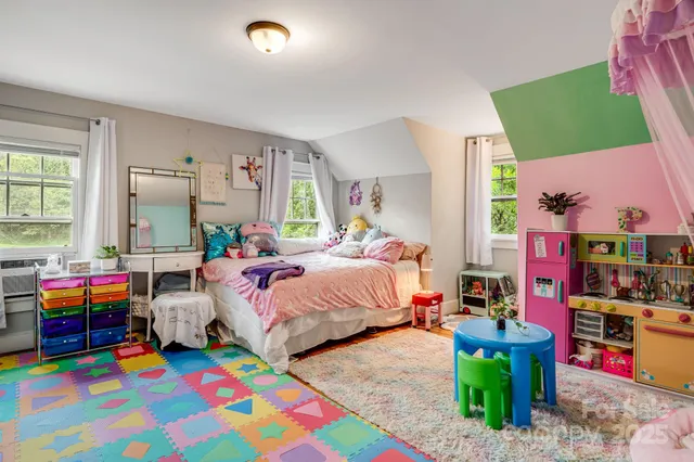 a bedroom with bed and window