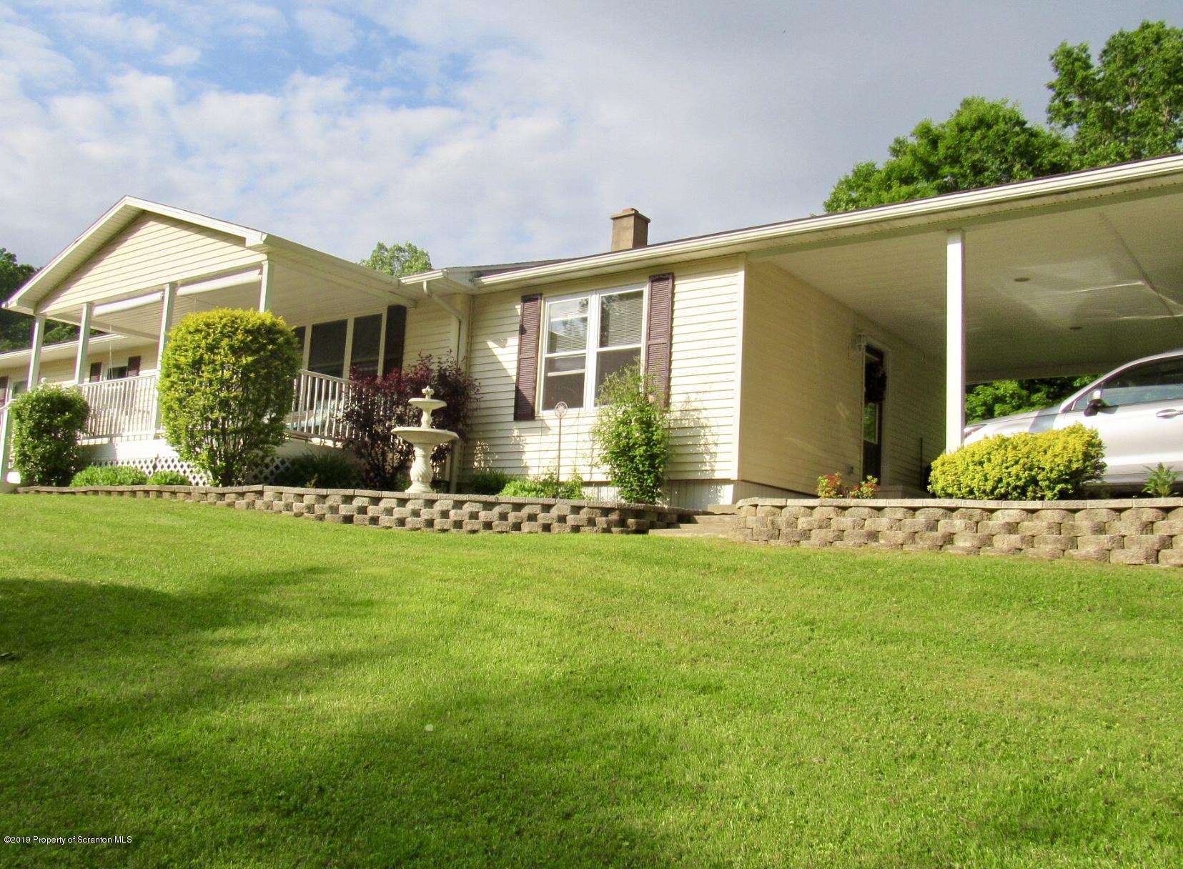 76 Ripplebrook Road Tunkhannock, PA 18657 - Photo 2 of 37 a front view of house with yard and outdoor seating