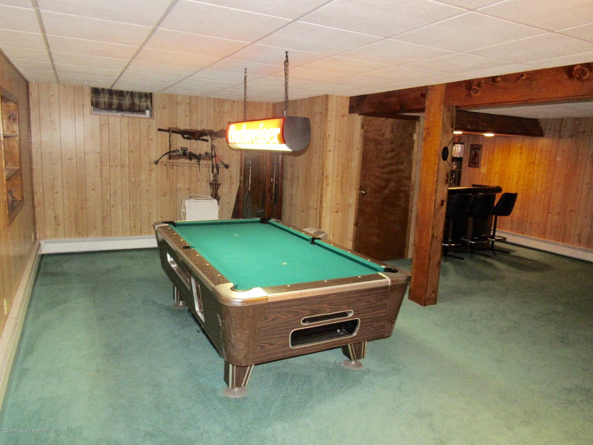 76 Ripplebrook Road Tunkhannock, PA 18657 - Photo 23 of 37 a room with pool table and a chandelier