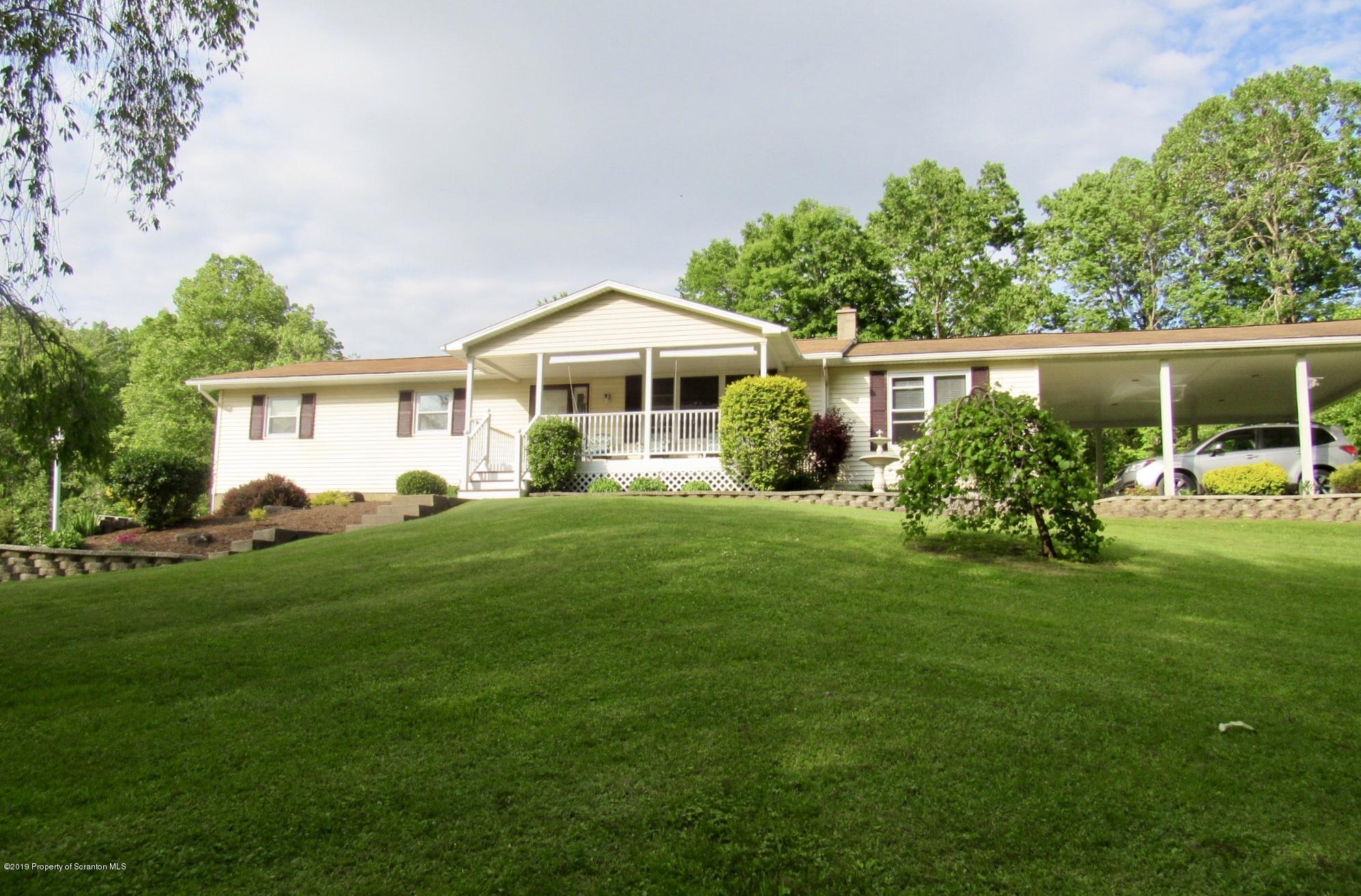 76 Ripplebrook Road Tunkhannock, PA 18657 - Photo 29 of 37 a front view of a house with garden