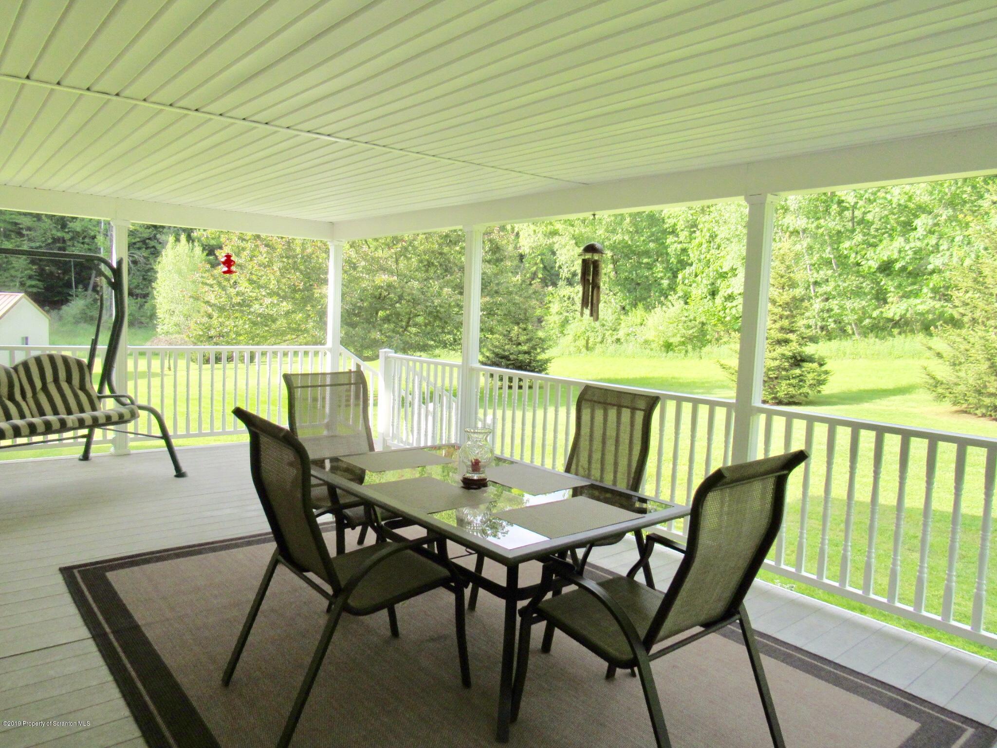 76 Ripplebrook Road Tunkhannock, PA 18657 - Photo 33 of 37 a view of a dining room with furniture window and outside view
