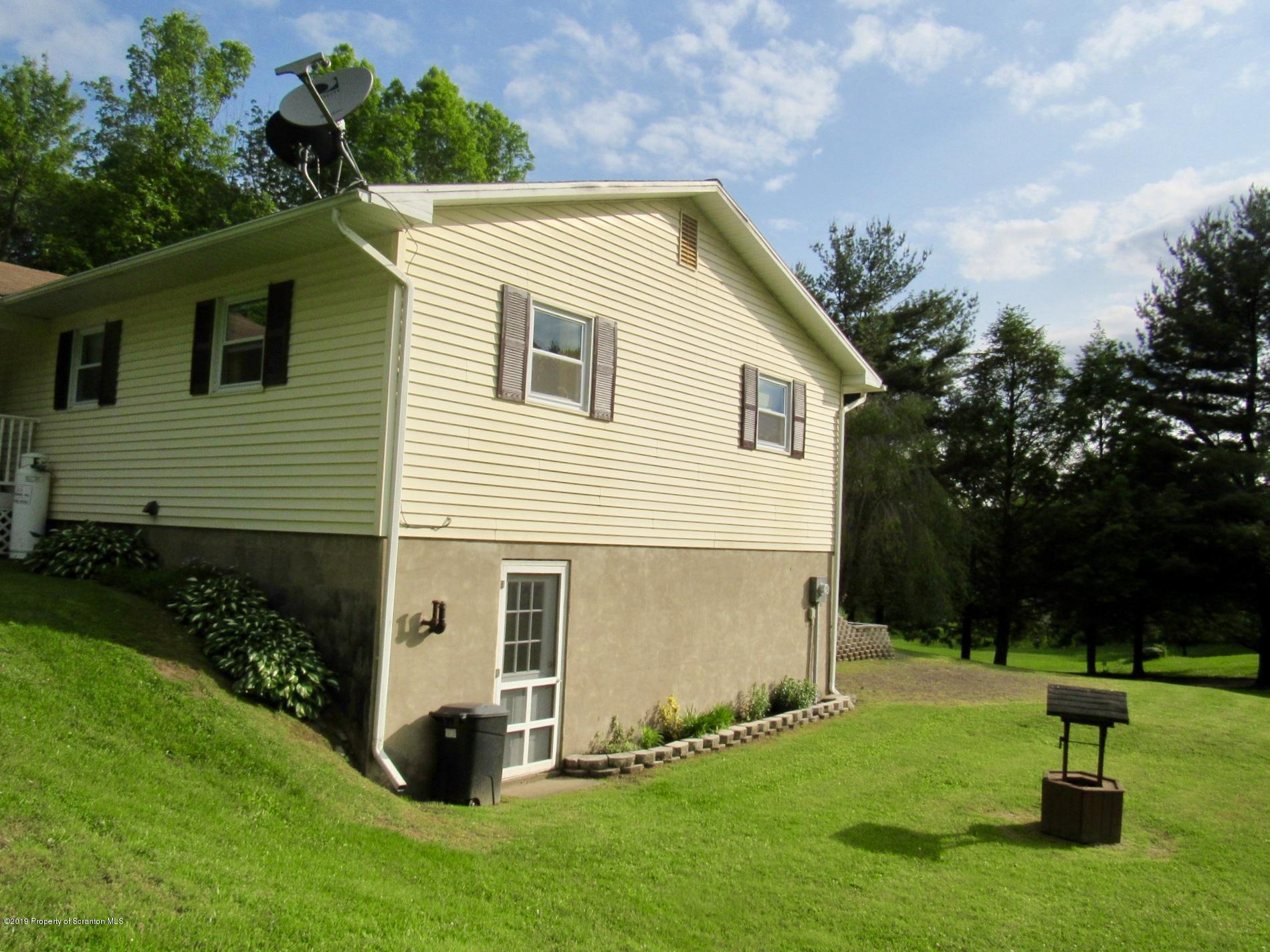 76 Ripplebrook Road Tunkhannock, PA 18657 - Photo 4 of 37 a view of backyard with a garden and entertaining space