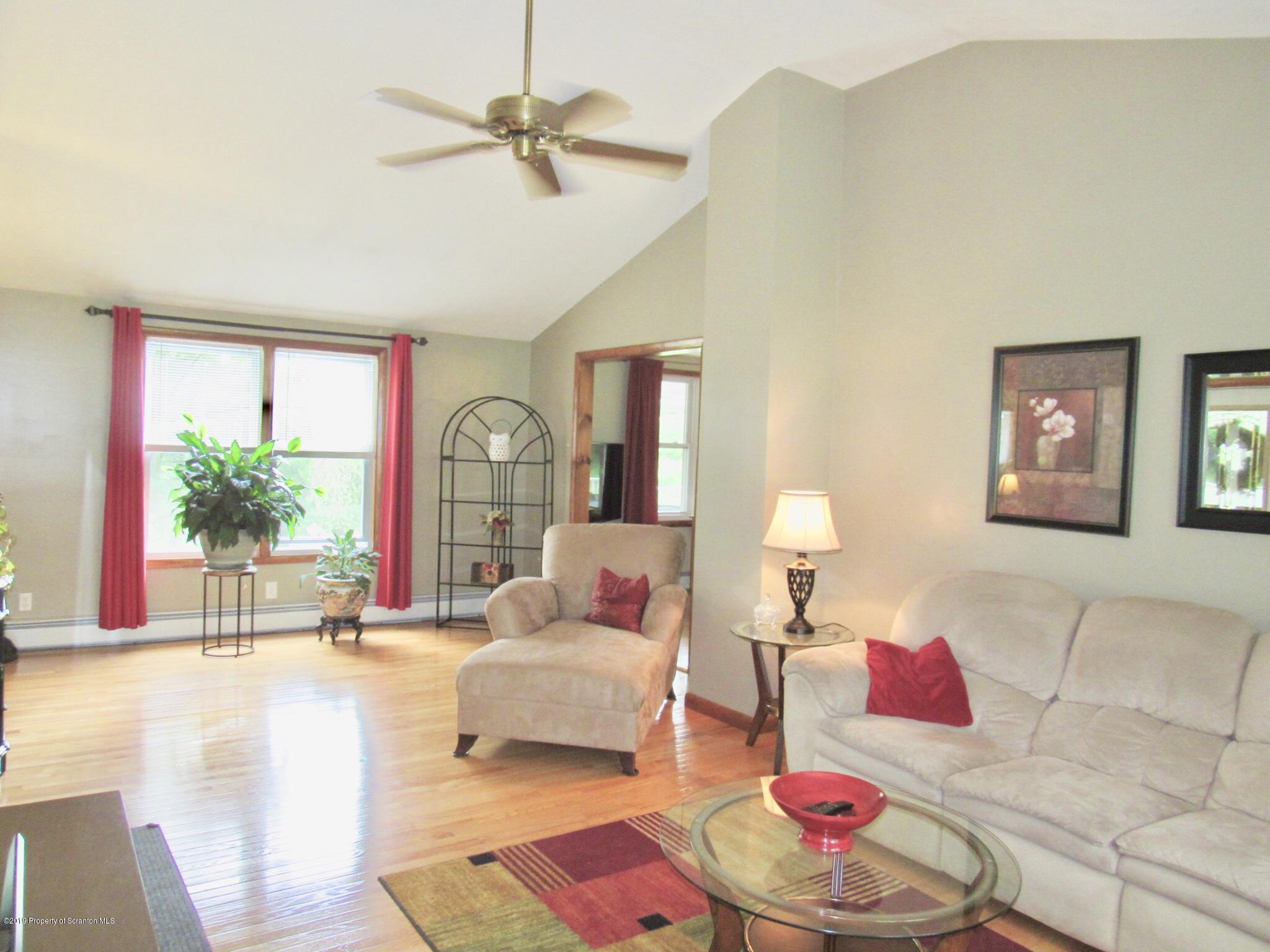 76 Ripplebrook Road Tunkhannock, PA 18657 - Photo 5 of 37 a living room with furniture and a potted plant