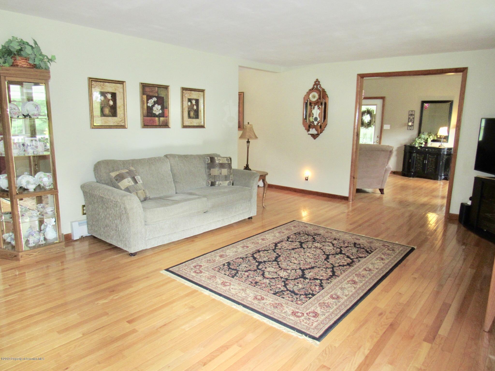 76 Ripplebrook Road Tunkhannock, PA 18657 - Photo 7 of 37 a living room with couch and a rug