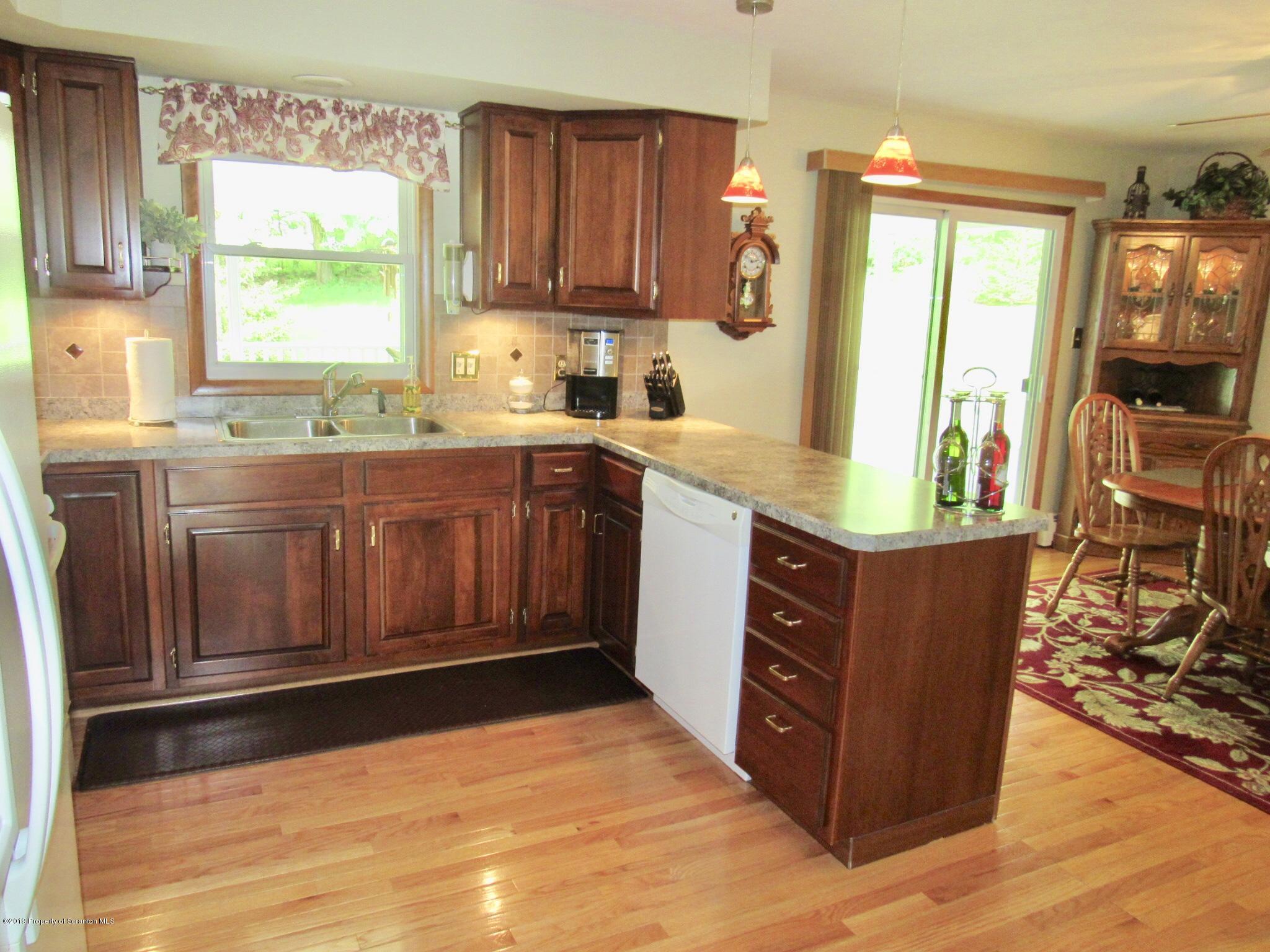 76 Ripplebrook Road Tunkhannock, PA 18657 - Photo 10 of 37 a kitchen with stainless steel appliances granite countertop a stove a sink and a microwave