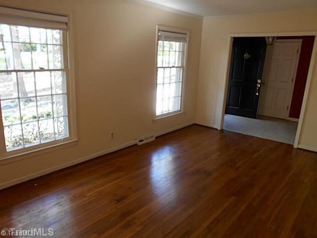 123 Sagewood Road Jamestown, NC 27282 - Photo 2 of 16 Living Room. The open living room is right off of the entrance. Large windows fill the room with airy, natural light.