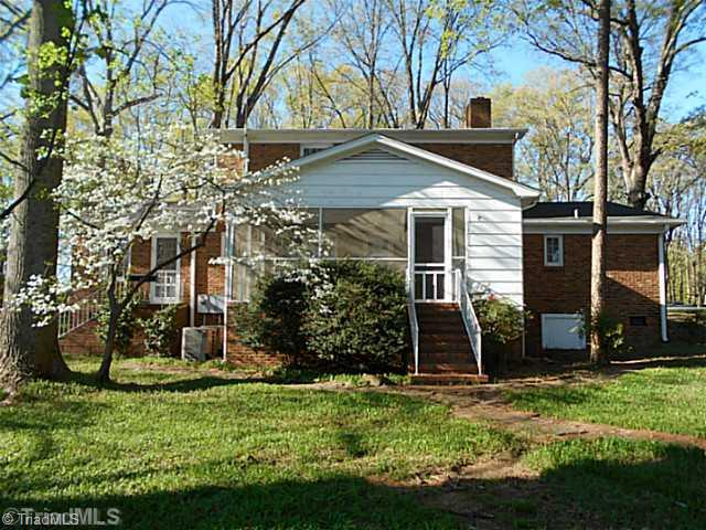 123 Sagewood Road Jamestown, NC 27282 - Photo 13 of 16 Exterior Back. Dogwood trees give this spacious backyard a traditional North Carolina feel!