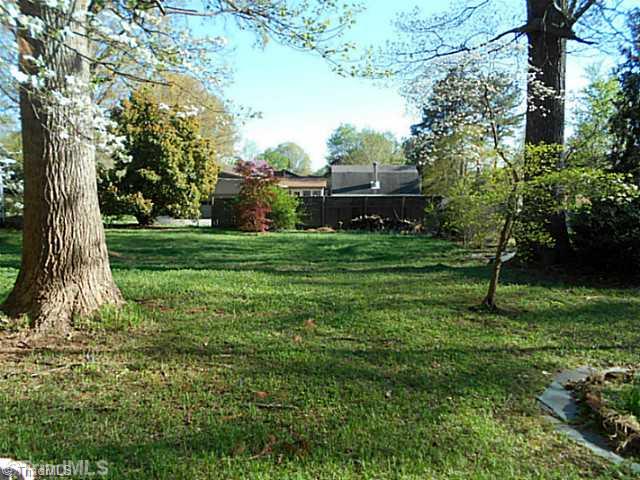 123 Sagewood Road Jamestown, NC 27282 - Photo 14 of 16 Exterior Back. Beautiful open backyard has lots of room for a garden or even a horseshoe pit to enjoy with family and friends!
