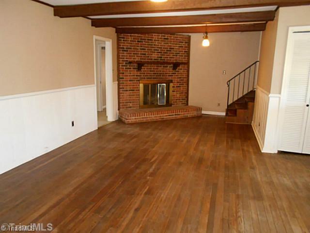 123 Sagewood Road Jamestown, NC 27282 - Photo 7 of 16 Den/Family/Great Room. Cozy up in front of your beautiful brick fire place before heading up the stairs to bed!
