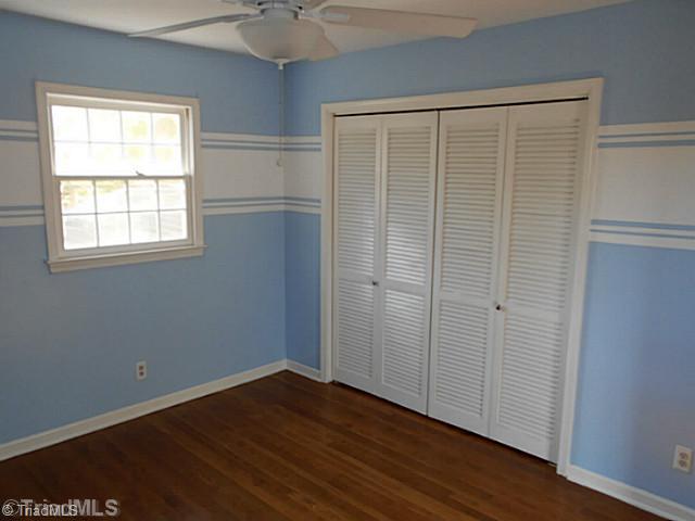 123 Sagewood Road Jamestown, NC 27282 - Photo 9 of 16 2nd Bedroom. 2nd bedroom is located immediately off the stairway. Equipped with new ceiling fan and beautiful view of side yard.