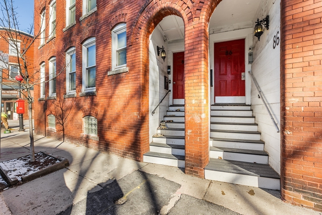 86 Savin Hill Avenue, Unit 1 Boston, MA 02125 - Photo 12 of 17 a view of a building with stairs